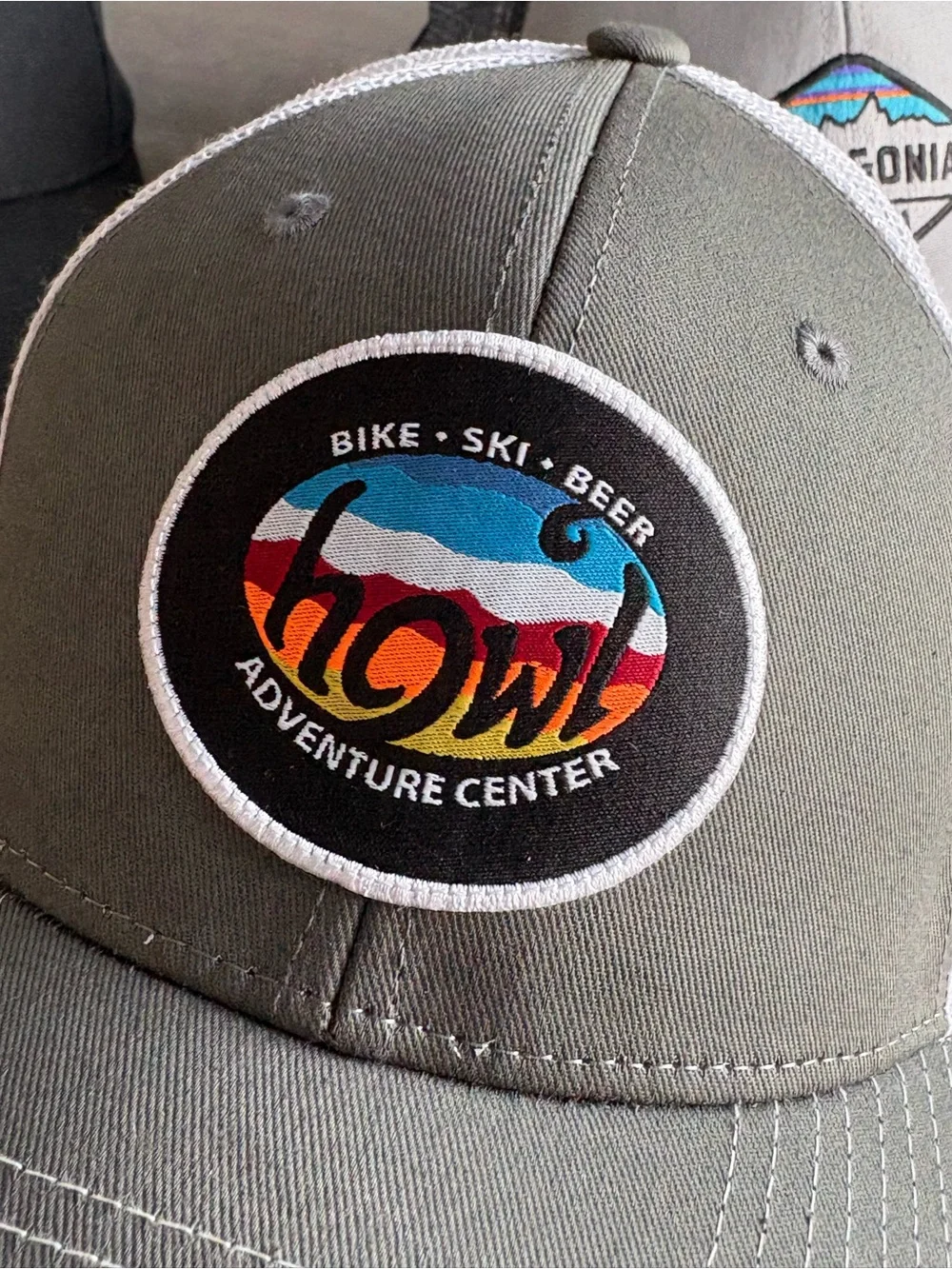 Zephyr Gray and White Trucker Hat with Colorful Howl Patch